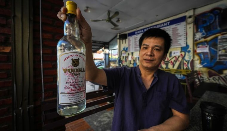 Mass poisoning blamed on tainted alcohol in Laos, with American among five tourists dead