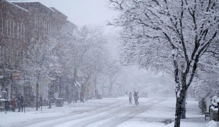 Snow could dash holiday weekend travel for the Great Lakes, while the South is under a freeze watch