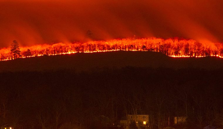 Parched fields and damaging blazes: The Northeast drought and wildfires in photos