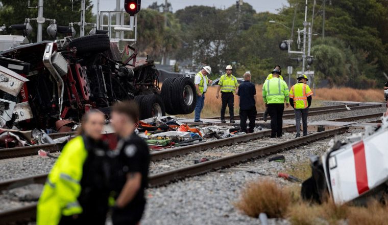 Passenger train collides with fire truck in Florida, injuring 3 firefighters and 12 other people