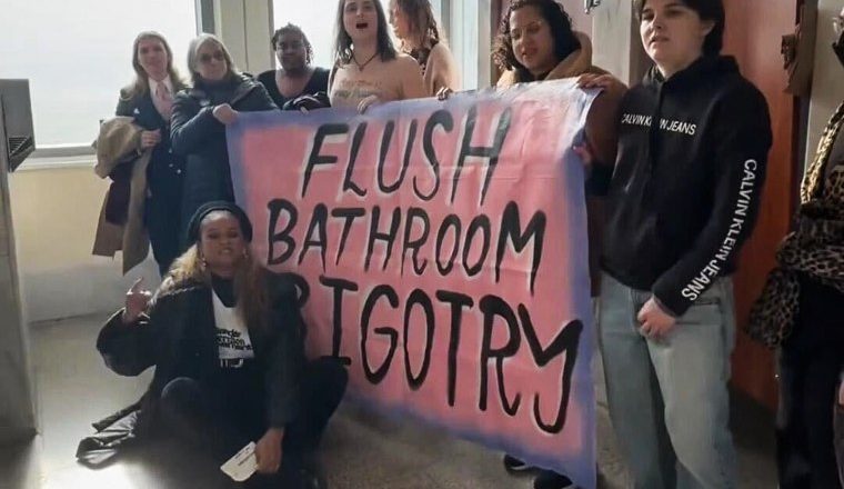 Transgender advocates stage a sit-in protest at a U.S. Capitol bathroom