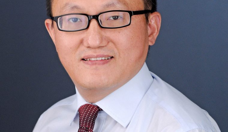 Asian American professor wrongfully accused of spying for China is suing University of Kansas