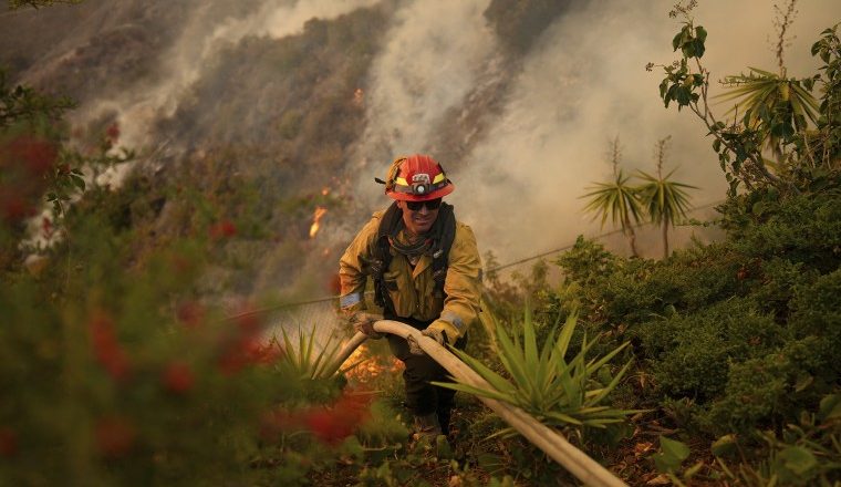 Firefighters battle to contain L.A. fires as Santa Ana winds are forecast to pick back up