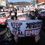 South Korean president defies arrest in standoff with officials over martial law order