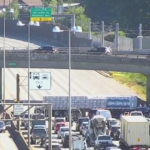 Massive Delays on I-80/35 After Truck Slams Into Barrier, Sends Debris Flying Across Highway
