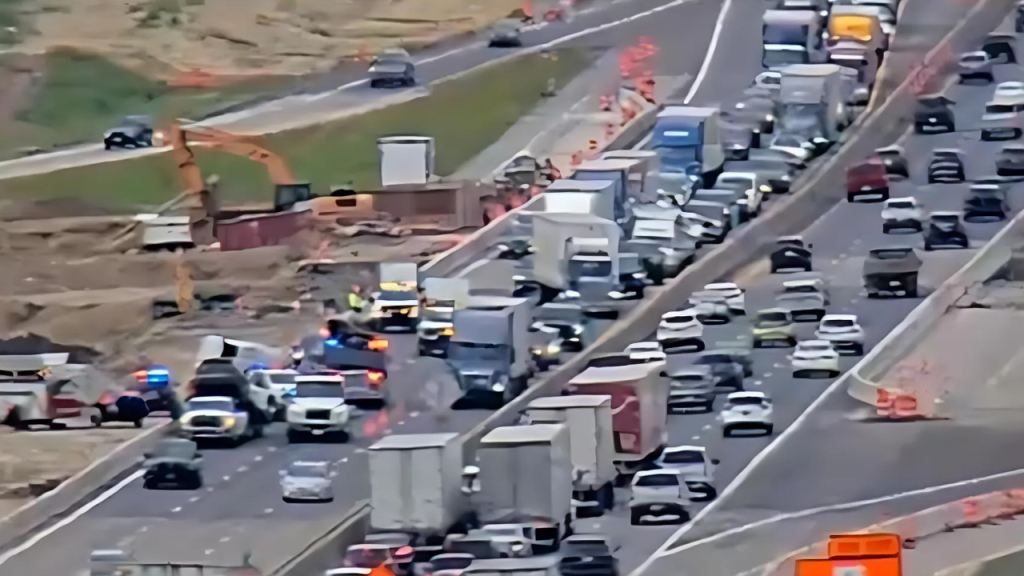 Massive Delays on I-80/35 After Truck Slams Into Barrier, Sends Debris Flying Across Highway